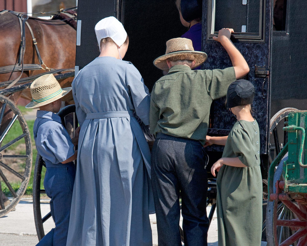 An Old-Order Amish family loading their horse-drawn buggy, the families who handweave every Amish Baskets basket