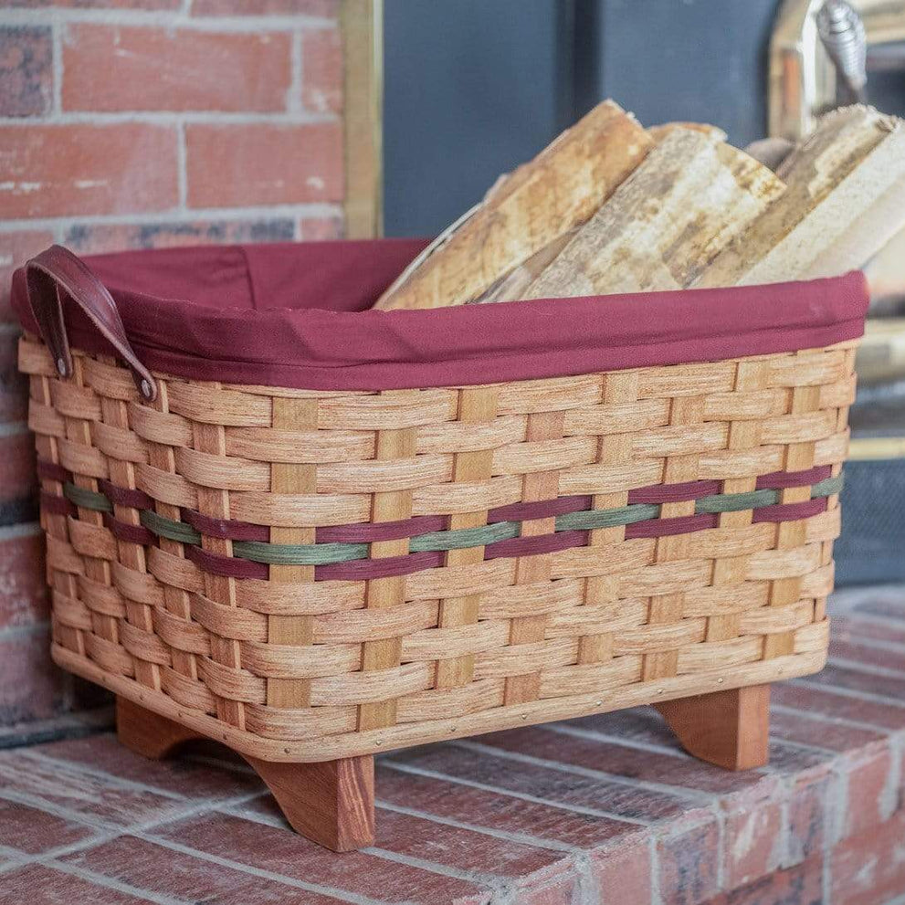 Amish handwoven fireplace log basket with wine liner and leather handles holding firewood on a brick hearth